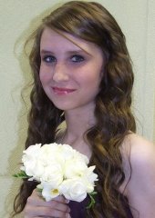 Bridesmaid holding flowers and smiling