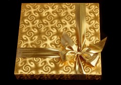 Gift A present in a golden gift box with a golden bow