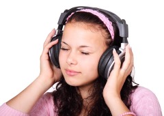 Litening Girl listening with headphones