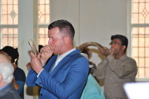 Blowing the shofar to open the feast