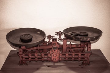A pair of old scales with weights in